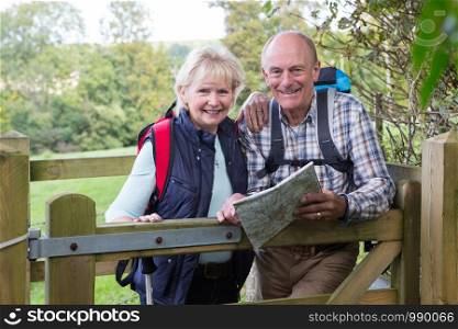 Active Senior Couple On Walk In Countryside