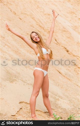 active slender girl in bikini on career stretches