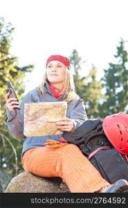 Active young woman backpack search navigation map rock climbing