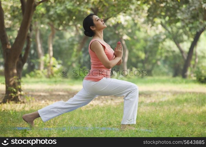 Active young woman practicing yoga