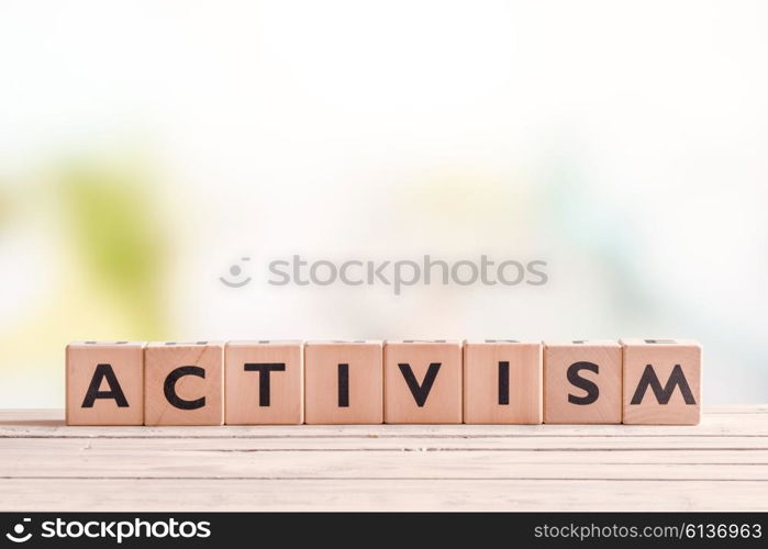 Activism word on wooden cubes on a table