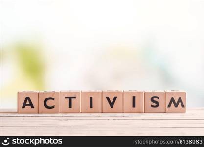 Activism word on wooden cubes on a table