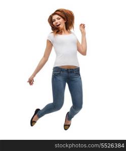activity and happiness concept - smiling teenage girl in white blank t-shirt jumping