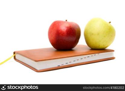 &acute;Back to school&acute; concept with books and apples on white