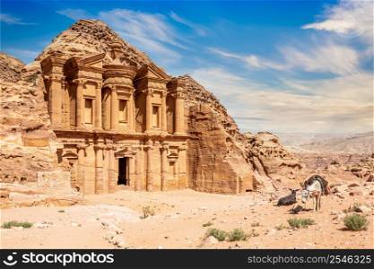 Ad Deir or The Monastery, ancient Nabataean stone carved temple, with donkeys in the foreground, Petra, Jordan