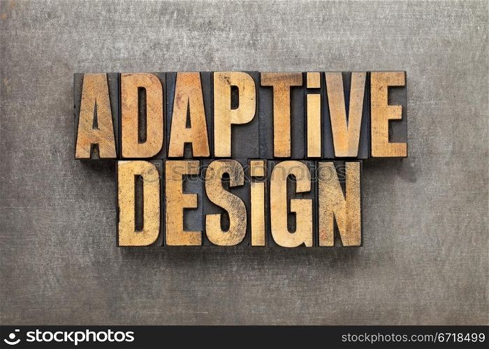 adaptive design - text in vintage letterpress wood type against grunge metal surface
