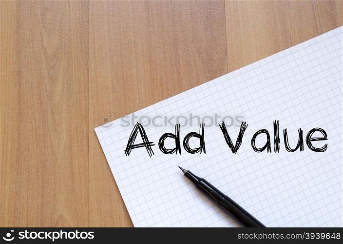 Add valuer text concept write on notebook with pen