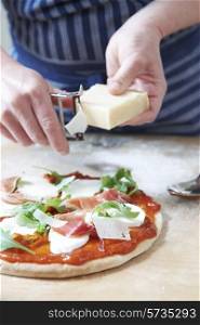 Adding Ingredients To Home Made Pizza Base