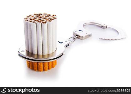 Addition concept with cigarettes and handcuffs