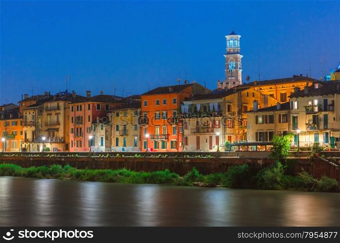 Adige River Embankment and Tower Lamberti at night illumination, Verona, Italy