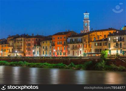 Adige River Embankment and Tower Lamberti at night illumination, Verona, Italy