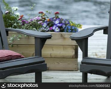 Adirondack chairs on a deck, Lake of the Woods, Ontario, Canada