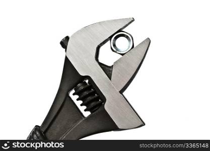 Adjustable wrench and nut isolated on white background