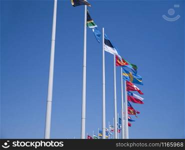 Adler city/ Russia - August 2019: Flags of the countries of the world on flagpoles in Olympic Park