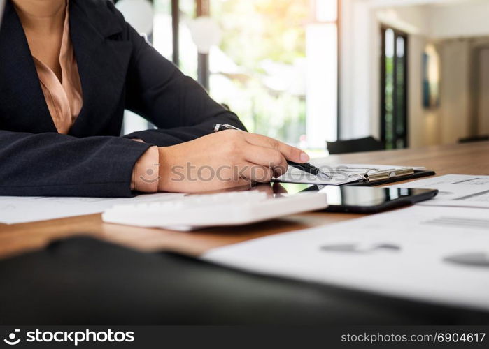 Administrator business man financial inspector and secretary making report, calculating balance. Internal Revenue Service checking document. Audit concept