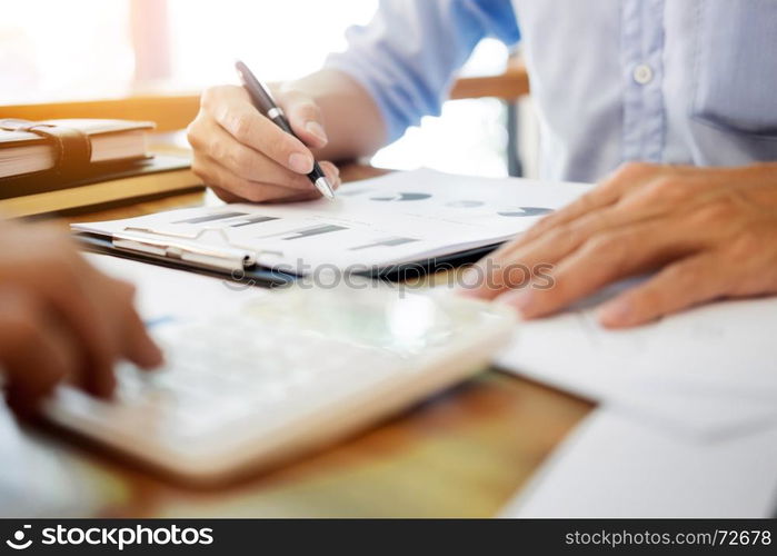 Administrator business man financial inspector and secretary making report, calculating balance. Internal Revenue Service checking document. Audit concept