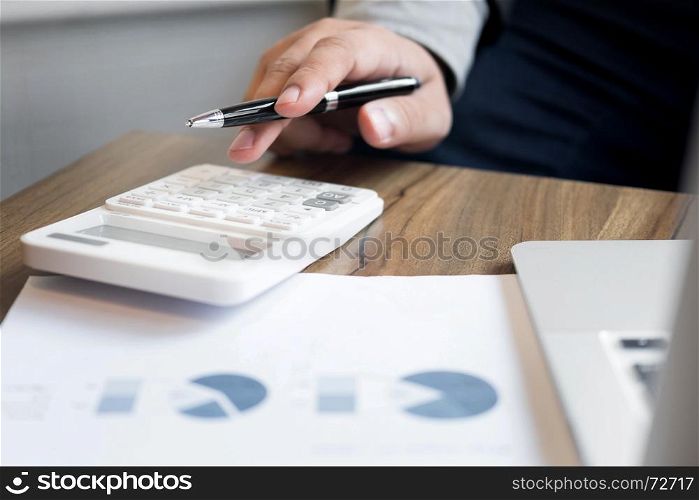 Administrator business man financial inspector and secretary making report, calculating balance. Internal Revenue Service checking document. Audit concept