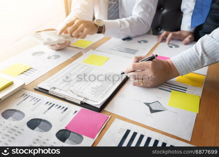 Administrator business man financial inspector and secretary making report, calculating or checking balance. Internal Revenue Service inspector checking document. Audit concept