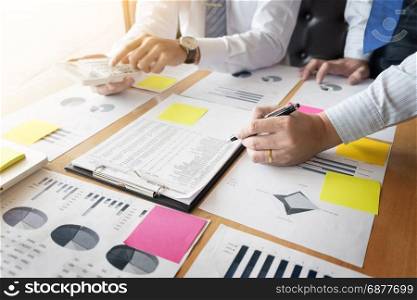 Administrator business man financial inspector and secretary making report, calculating or checking balance. Internal Revenue Service inspector checking document. Audit concept
