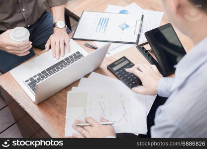 Administrator business man financial inspector and secretary making report, calculating or checking balance. Internal Revenue Service inspector checking document. Audit concept.