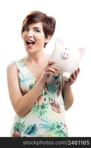 Admired woman with a piggy bank, isolated over a white background