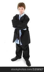 Adorable 10 year old american boy in baggy suit over white background.