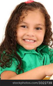 Adorable 3 year old hispanic american girl close up smiling.