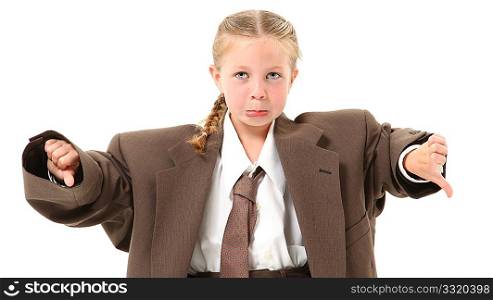Adorable 6 year old blonde girl in over-sized baggy suit with thumbs down and frown over white background.