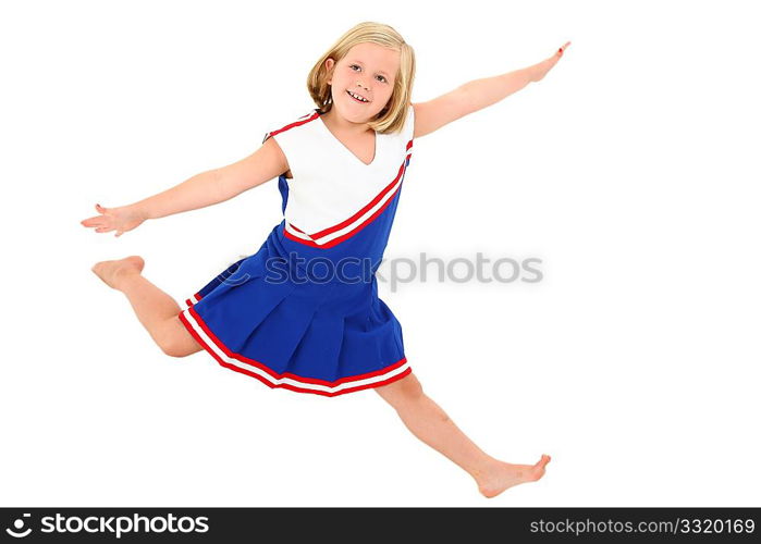 Adorable 7 year old blond american girl in cheerleader uniform barefoot over white background.