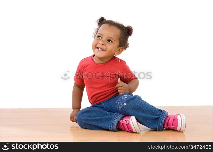 Adorable african baby sit over wooden floor