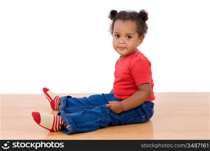 Adorable african baby sit over wooden floor