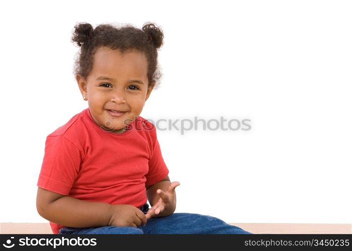 Adorable african baby sitting on a over white background