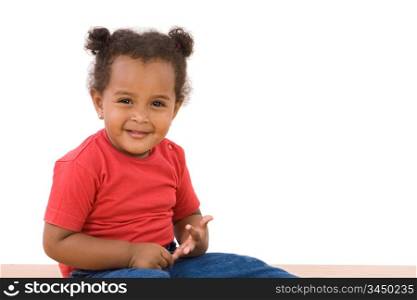 Adorable african baby sitting on a over white background