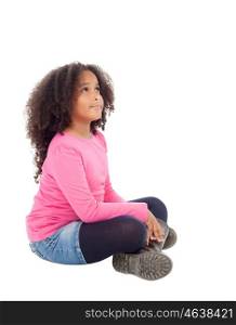 Adorable african little girl sitting on the floor isolated on white background