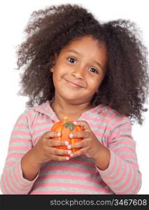 Adorable african little girl with beautiful hairstyle with a pumpkin isolated over white