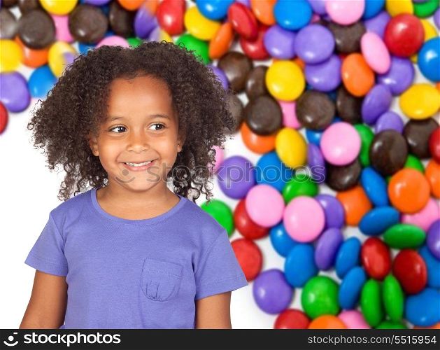 Adorable african little girl with many color candies