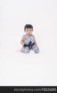 Adorable Asian baby girl is portrait on white background