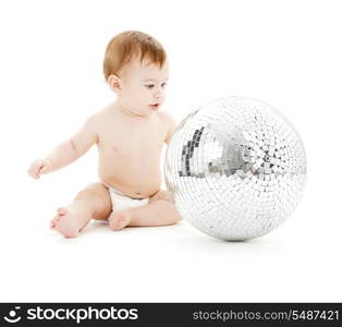 adorable baby boy with big disco ball over white