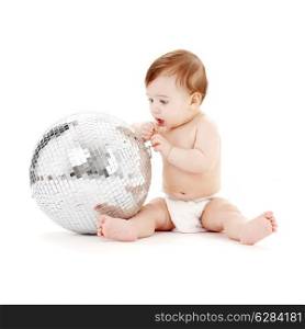 adorable baby boy with big glitterball over white