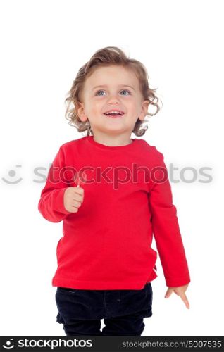 Adorable baby eating a lollipop isolated on a white background