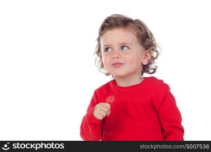 Adorable baby eating a lollipop isolated on a white background