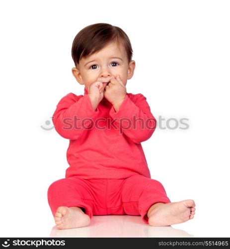 Adorable baby girl with her hand in mouth isolated on white background