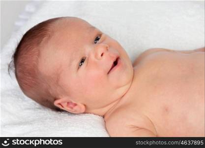 Adorable baby newborn smiling isolated on a white background