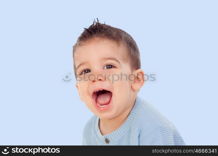 Adorable baby nine months on a blue of background