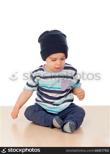 Adorable baby nine months sitting on the floor