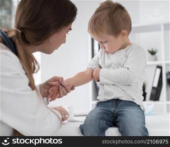 adorable baby waiting be checked by doctor