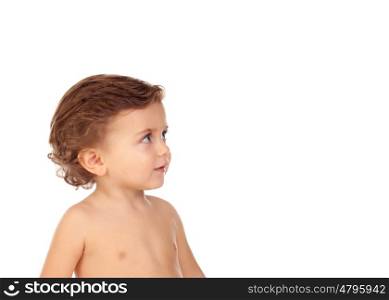 Adorable baby with blue eyes looking up isolated on a white background