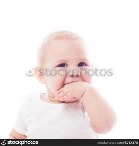 Adorable baby with finger in the mouth