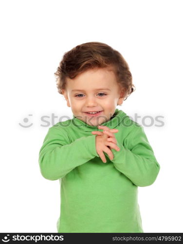 Adorable baby with green shirt isolated on a white background