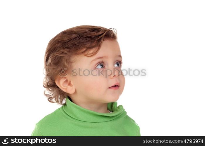Adorable baby with green shirt isolated on a white background
